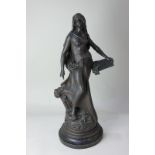 After Auguste Moreau, a French spelter figure of a woman, 'L' Inspiration', on circular plinth