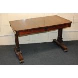 A Victorian rosewood library table, the rectangular top with rounded corners, above two frieze