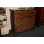 A 19th century mahogany chest of two short over three long drawers, the canted corners with reeded