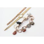 A 9ct gold oval link bracelet, hung with various charms, a 9ct gold bracelet watch, a 9ct watch
