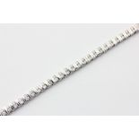 A diamond bracelet, baton set with pairs of round brilliant cuts in 14ct white gold