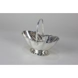 A Victorian silver bonbon basket, oval shape with swing handle, on pierced base, maker Fordham &
