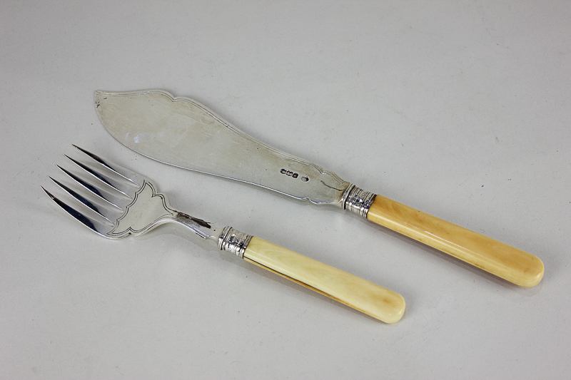 A pair of George V silver fish servers with ivorine handles, maker William Hutton, Sheffield 1927