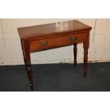 An Edwardian style side table, with rectangular top above drawer with brass shell embossed back