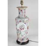 A Chinese porcelain baluster vase converted to a table lamp, with polychrome decoration of flowers