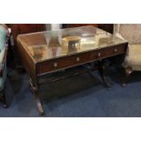 A Regency style mahogany inlaid sofa table, the crossbanded top with conch shell patera, the two
