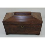 A 19th century sarcophagus shaped tea caddy, fitted with two lidded compartments, and associated