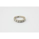 A diamond half hoop ring, set with nine uniform brilliant cut stones