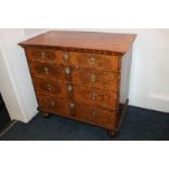 An 18th century continental oak, mahogany and walnut crossbanded chest of four long graduated