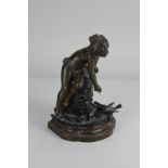 After Auguste Moreau (French, 1834-1917) a bronze sculpture of a nude girl feeding a bird on a