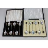 A cased modern silver gilt and enamel set of six coffee spoons, with coffee bean terminals, and