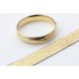 A 14ct yellow gold hinged bangle and a gilt metal bracelet, 20g weighable