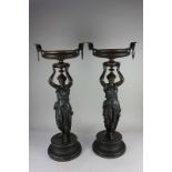 A pair of spelter urns with classical female figural supports on plinth bases 64cm high (a/f-one