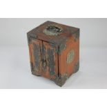 A Chinese gilt metal mounted rosewood table top cabinet with two doors enclosing three drawers, with
