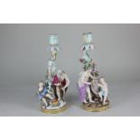A pair of 19th century Dresden porcelain candlesticks, the tree and flowering branch rococo scroll