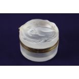 A Lalique crystal 'Daphne' powder box, the lid moulded with a sinuous nude figure, etched mark to