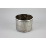 A Christopher Nigel Lawrence modern silver bottle coaster, cylindrical form with textured surface