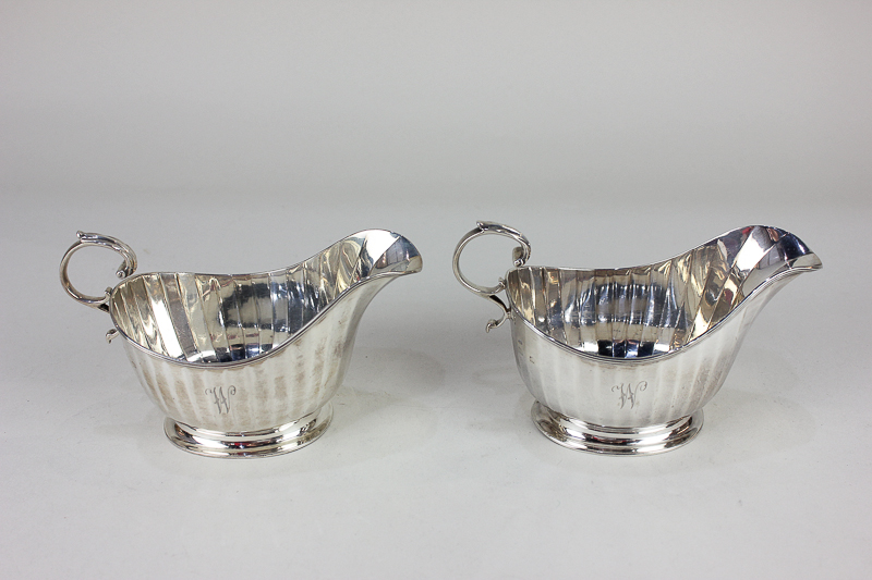 A pair of George V silver sauce boats, makers Adie Brothers, Birmingham, 1925, initialled 'W' 8oz