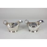 A pair of George V silver sauce boats, makers Adie Brothers, Birmingham, 1925, initialled 'W' 8oz