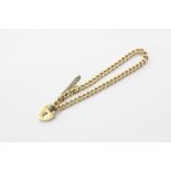 An 18ct gold curb link bracelet with padlock clasp, 25.8g