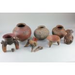 A collection of Central American pottery, possibly from Costa Rica, comprising three tripod vessels,