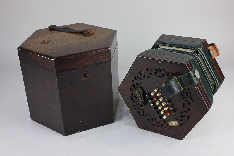 A 19th century rosewood cased forty eight button concertina by Charles Wheatstone in original