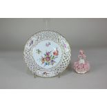 A German Saxe porcelain plate with pierced border and hand painted floral design, together with an