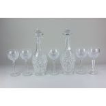 A pair of Waterford crystal wine decanters together with a set of five Waterford crystal wine