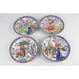 A set of four 20th century Chinese porcelain plates decorated with chrysanthemums, birds, cherry