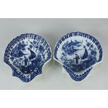 A near pair of 19th century blue and white porcelain scallop shell shaped dishes, depicting a