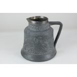 A silver mounted tavern jug, decorated in light relief with a continuous scene beneath tubeline