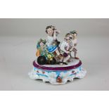 A porcelain figure group of a child on a cart of flowers being pulled by two others, on oval base