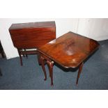 An early 20th century walnut drop leaf side table, rectangular top with shaped corners, on slender