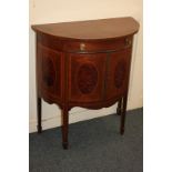 An Edwardian inlaid mahogany demi lune cabinet with fan shaped inlaid top above drawer and two