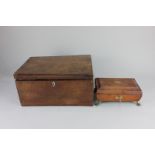 A brass mounted and leather covered sewing box, with lion mask ring handles, paw and ball feet and