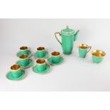 A Crown Devon porcelain green and gilt coffee set, comprising coffee pot, milk jug, sugar bowl,