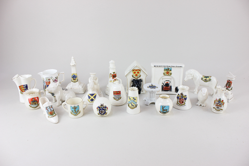 A collection of Goss, Arcadia, Swan and Shelley crested china, including a German bomb with