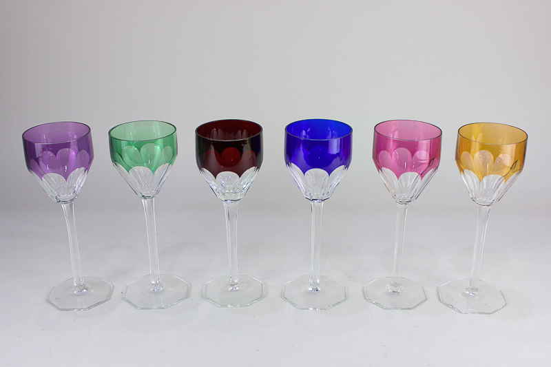A set of six harlequin hock glasses, each with slender faceted stem on octagonal foot, 20cm