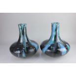 A pair of 20th century pottery vases in the style of Poole with blue drip glaze 27cm high