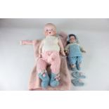 Two Armand Marseille bisque head dolls, one marked Armand Marseille Germany 390. A.5/0.M., with blue