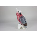 A Beswick porcelain model of a cockatoo, in pink and grey gloss, paper label to base, 29.5cm high