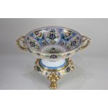 A Japanese Noritake porcelain two handled pedestal bowl on stand, with polychrome floral