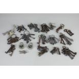 A collection of various furniture keys, house keys and padlocks