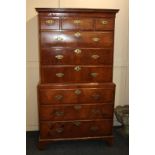 A George III walnut chest on chest, the top section with three short over three long drawers, on