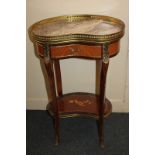 A Louis XVI style gilt metal mounted kidney shape side table, marble top with brass gallery and