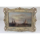 Maritime school, boats at sunset, with figures on a shoreline, oil on board, unsigned, 18.5cm by