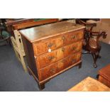 A mid 18th century chest of three walnut graduated drawers, on bracket feet, with burr wood and