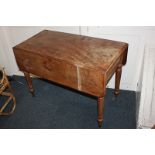 A 19th century mahogany Pembroke table with twin flaps and drawer, on turned baluster feet and