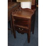 A George III mahogany tray-top pot cupboard with three-quarter gallery top above cupboard and