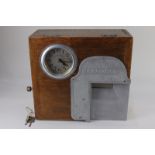 A National Time Recorder Co Ltd clocking in machine, the clock with Arabic dial, internal paper roll